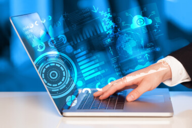 Modern notebook computer with future technology symbols